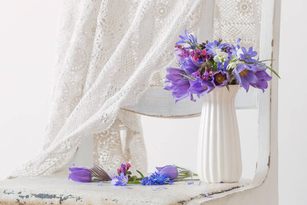 bouquet of spring violet flowers on white background