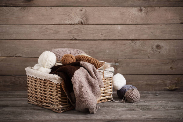 Knitting and knitting needles on a wooden surface
