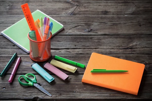 School supplies on dark old wooden  background — Stock Photo, Image