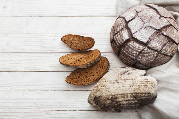 Homemade bread on  white wooden background — Stok fotoğraf