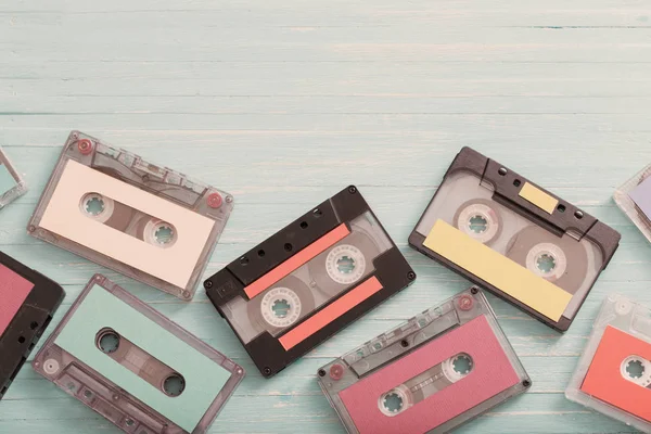Old plastic cassette on wooden background. Retro music concept — Stock Photo, Image