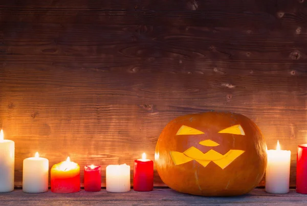 Halloween pumpkin on old wooden background — Stock Photo, Image