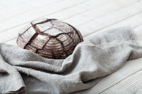 Homemade bread on  white wooden background — Stockfoto