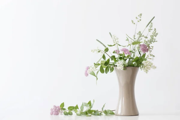 Summer flowers in vase on table — Stock Photo, Image