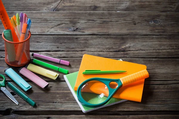 School supplies on dark old wooden  background — Stock Photo, Image