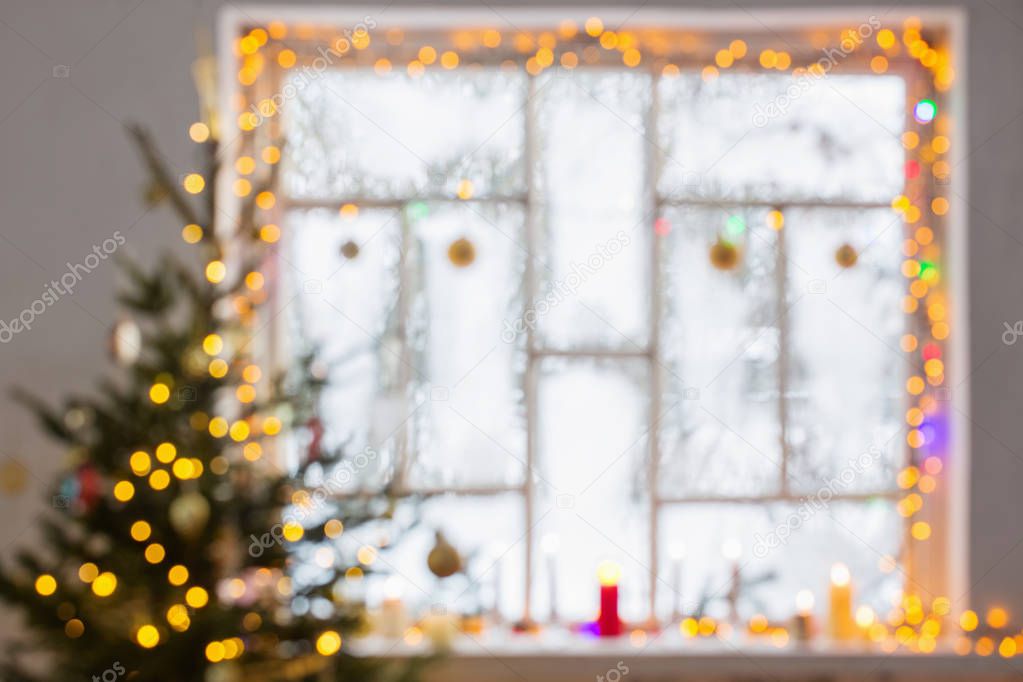 Christmas decorations on old wooden window  out of focus