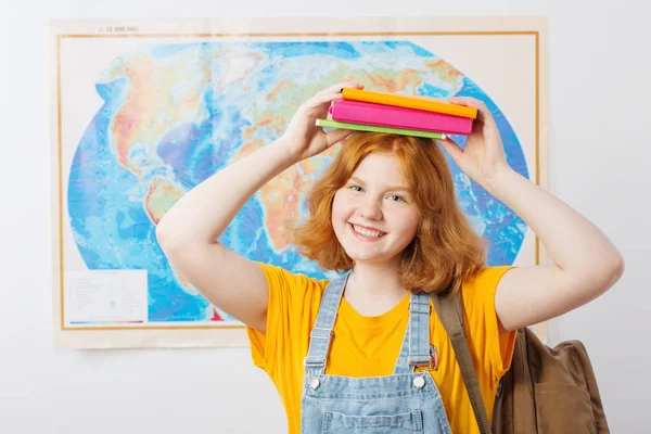 Teen girl stands at  geographical map — Stock Photo, Image