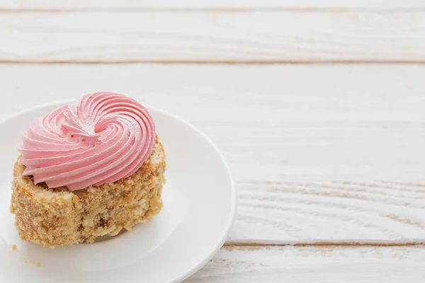 Cakes on  white wooden background — Stock Photo, Image