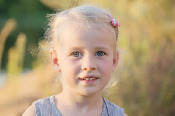 Beautiful little blonde smile  girl close up — Stock Photo, Image