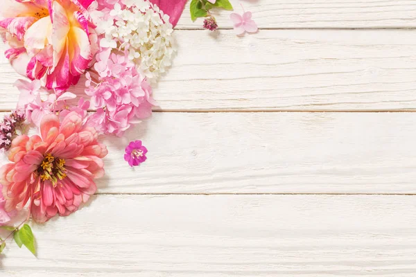 Pink flowers on white wooden background — Stock Photo, Image