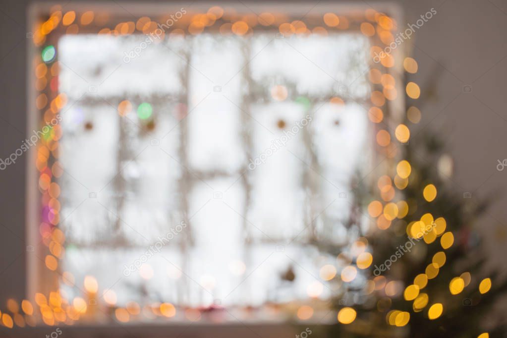 Christmas decorations on old wooden window  out of focus