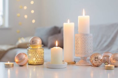 Christmas decorations with candles at home clipart