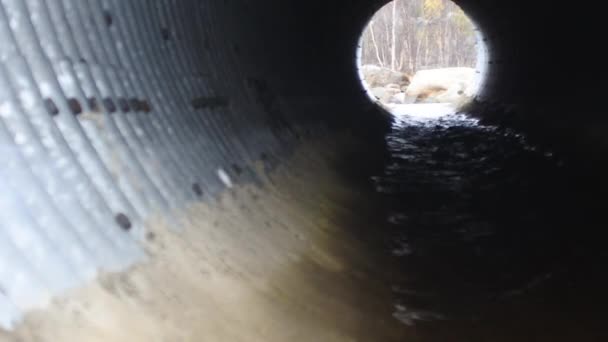 Culvert - drain under road for small river. — Stock Video