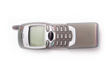 Eski cep telefonu. Beyaz arkaplanda kullanım dışı bırakılmış telefon