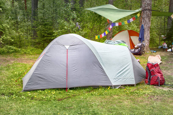 camping with a tent in the woods different options