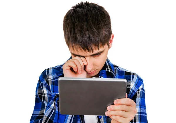 Trauriger Teenager Mit Einem Tablet Computer Auf Weißem Hintergrund — Stockfoto