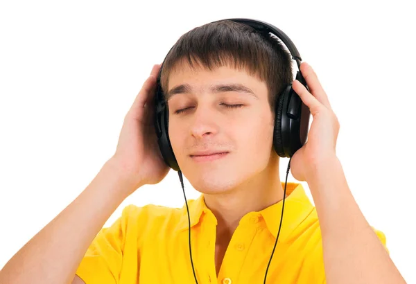 Joven Con Auriculares Escucha Música Aislado Fondo Blanco —  Fotos de Stock