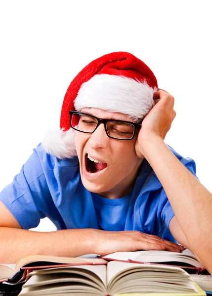 Müder Student Mit Weihnachtsmütze Gähnt Auf Weißem Hintergrund — Stockfoto