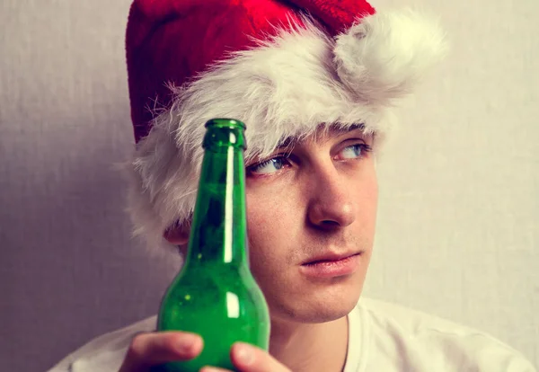 Toned Photo Sad Young Man Santa Hat Beer Wall Closeup — Stock Photo, Image