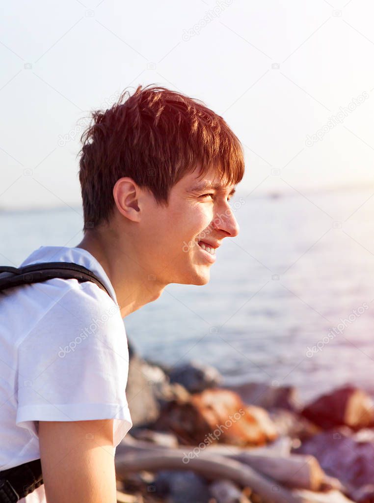 Happy Young Man on the Sea Background