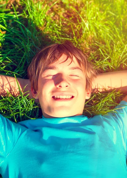 Toned Photo Happy Teenager Tomar Descanso Hierba Verde —  Fotos de Stock