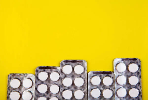 Pills Set Yellow Paper Background Closeup — Stock Photo, Image