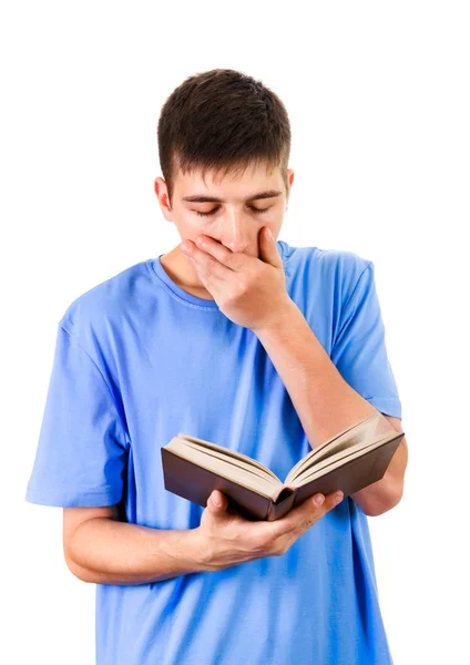 Βαρεθεί Νεαρός Χασμουρητό Ένα Βιβλίο Που Απομονώνονται Λευκό Φόντο — Φωτογραφία Αρχείου