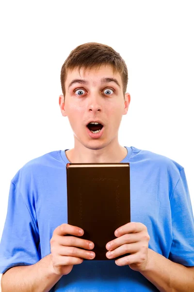 Удивленный Молодой Человек Показывает Книгу Изолированную Белом Фоне — стоковое фото