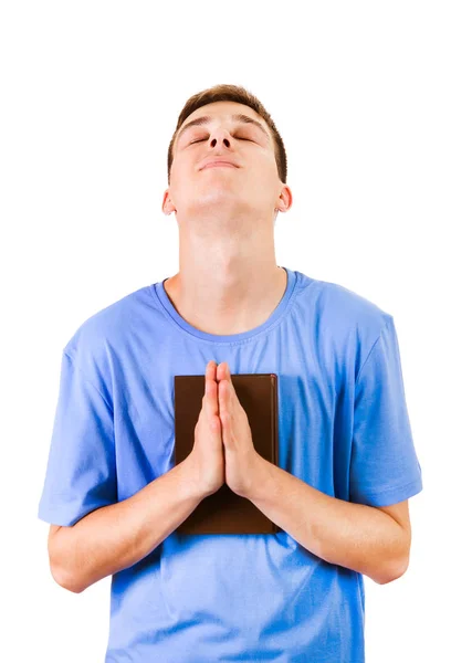 Молодой Человек Молится Библией Белом Фоне — стоковое фото