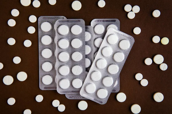 Pills Set on the Brown Paper Background closeup