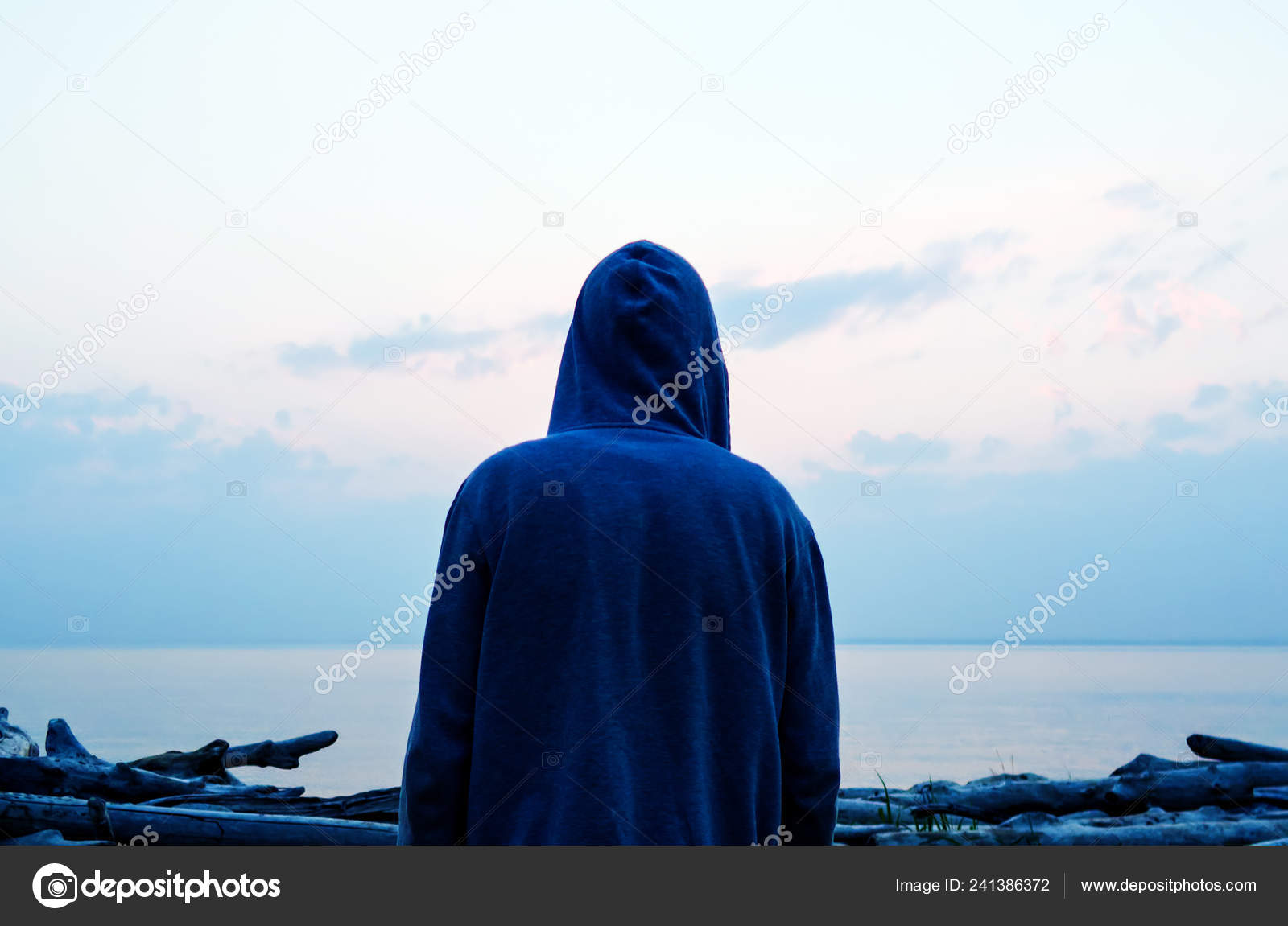 Silhouette Man Hoodie Sea Background — Stock Photo © sabphoto