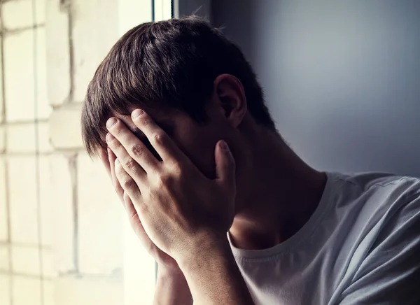 Sad Young Man Hide Face Window Room — Stock Photo, Image