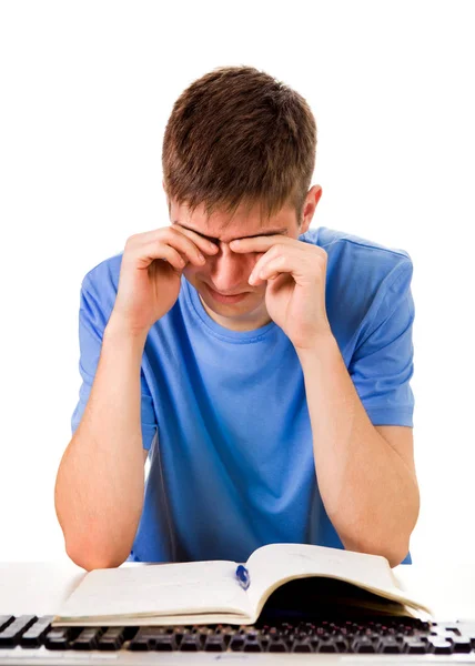 Estudante cansado com um livro — Fotografia de Stock