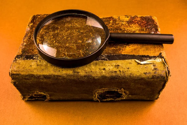 Old Book with a Magnifying Glass — Stock Photo, Image