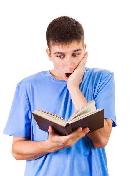 Homem surpreso com um livro — Fotografia de Stock