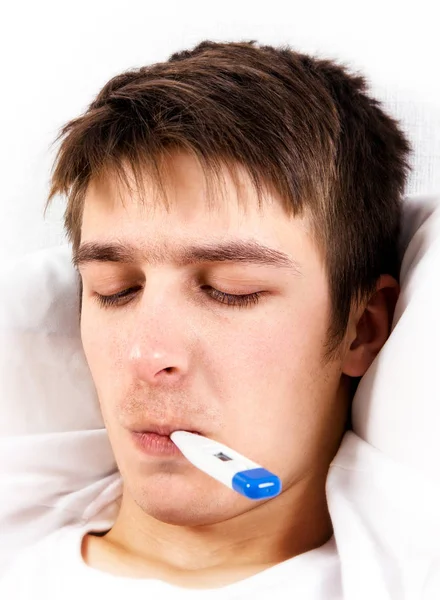 Young Man with a Thermometer — Stock Photo, Image