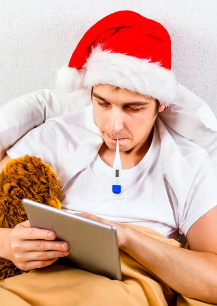 Homem doente em Santa Hat — Fotografia de Stock