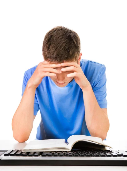 Печальный студент с книгой — стоковое фото