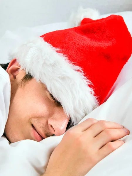 Man in Santa Hat sleeping