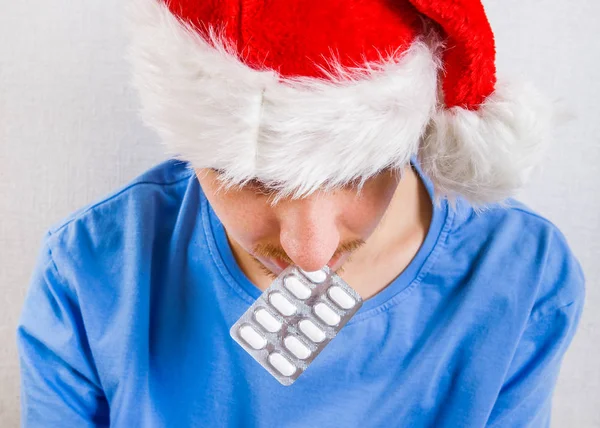 Sick Young Man in Santa Hat — Stock Photo, Image