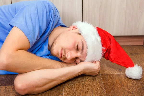 Mannen i Santa hatt sova — Stockfoto