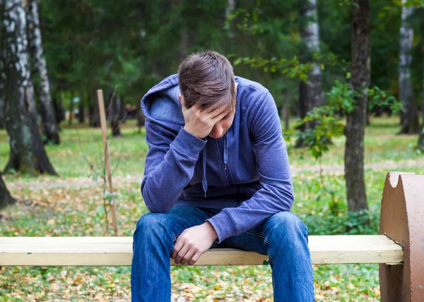 Sad Young Man Sit Bench Autumn Park — Stock Photo, Image