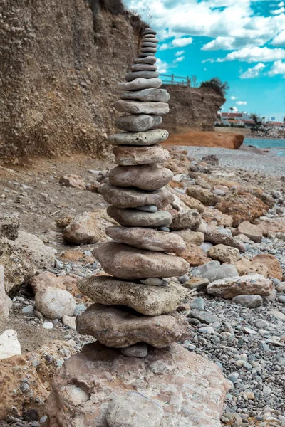 A stone pile on the sea beach. Stone tower closeup