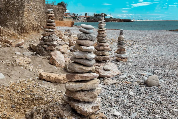 A stone pile on the sea beach. Stone tower closeup
