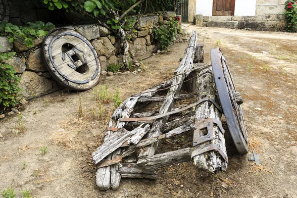 Traditional two-wheeler ox cart (or bullock cart) entirely made of timber in advanced state of disrepair, in Northern Portugal