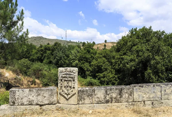 Detail of the royal shield of King Pedro, the Second, at the southern end of the bridge of Lavandeira, near Celorico da Beira, Beira Alta, Portugal