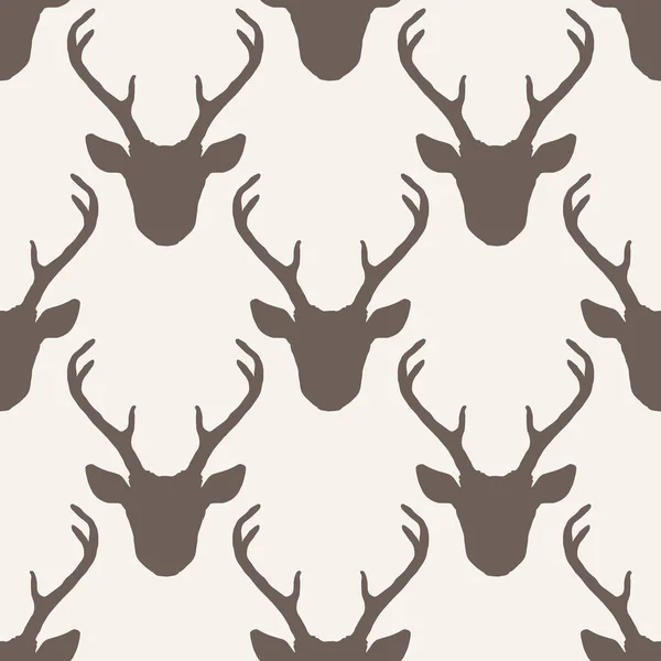 Modèle sans couture avec têtes de cerf silhouettes — Image vectorielle