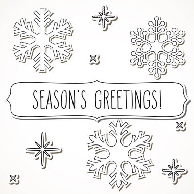 Beyaz kar taneleri ve el yazısıyla yazılmış bir çerçeve..