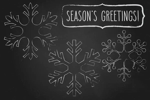 三片雪花和手写的圣诞祝福白色在黑色黑板之上 寒假病媒说明 — 图库矢量图片
