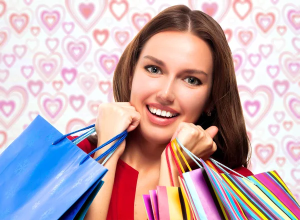 Pretty Woman Med Shoppingkassar Bakgrund Med Röda Hjärtan — Stockfoto